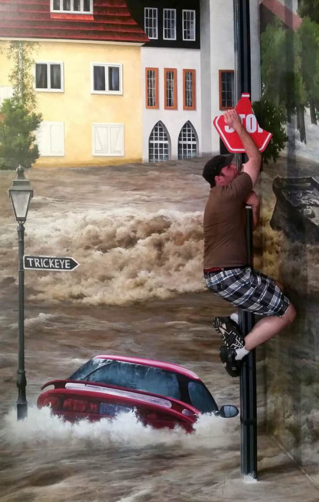 Escape-Flooding-Pose-at-Trick-Eye-Museum
