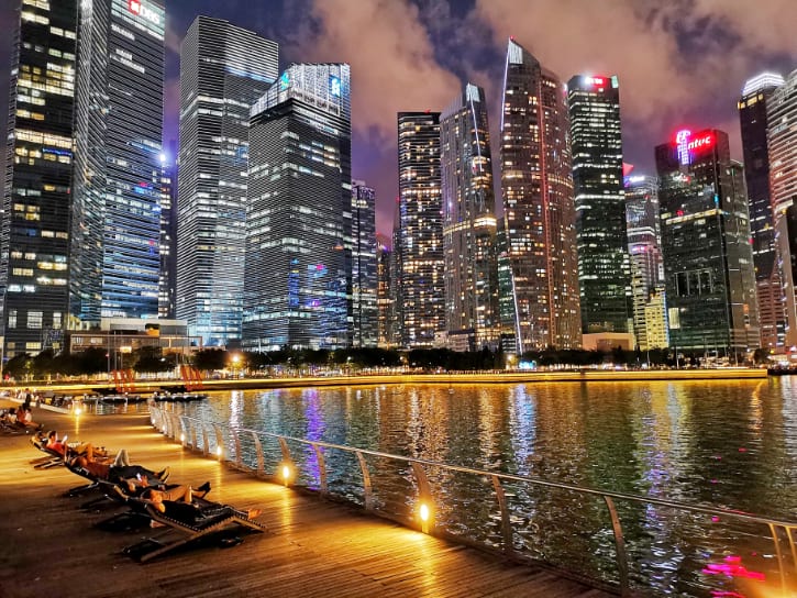 Tranquil evening walk along Marina Bay Waterfront Promenade with skyline views