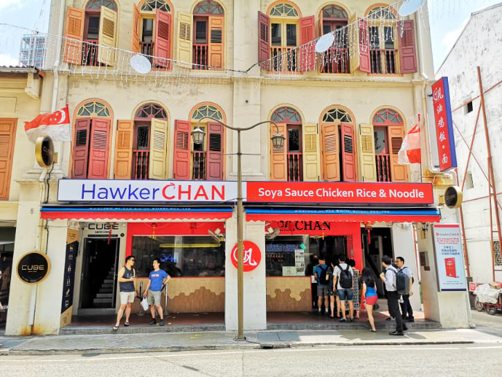 Liao Fan Hawker Chan's restaurant front, with its signature red and blue signboard