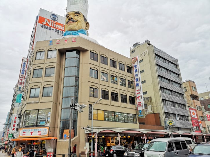 Giant chef mascot atop a building on Kappabashi Street