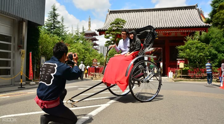 Traditional Japanese rickshaw with a friendly rickshaw puller in Asakusa