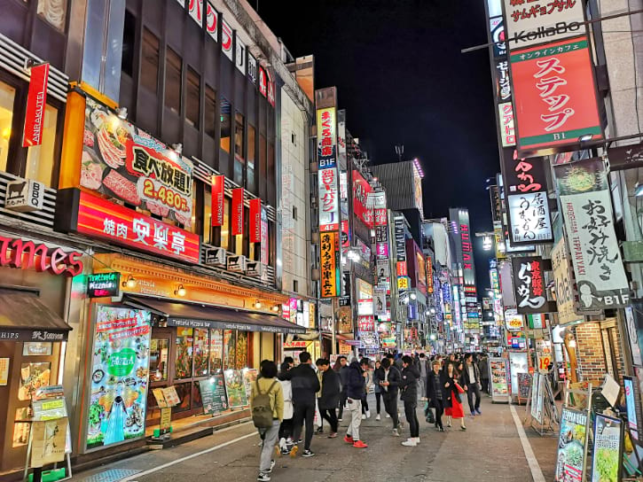 Bustling Kabukicho street scene, showcasing the lively atmosphere of Shinjuku's entertainment district