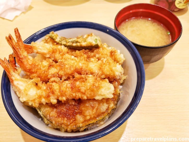 Crispy Tendon Tenya dish with golden tempura shrimp and vegetables over steamed rice