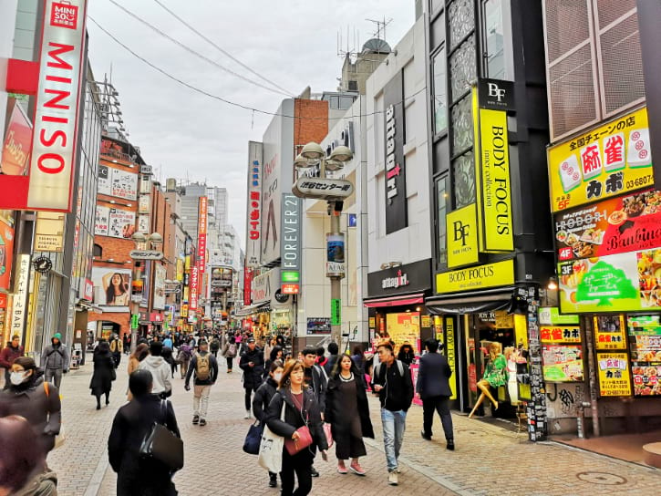 Shibuya Center-gai bustling with activity, lined with vibrant shops and eateries