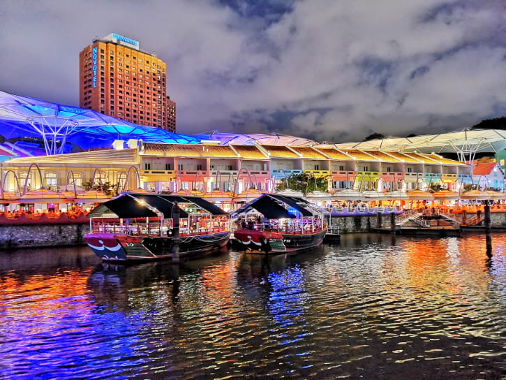 Colorful Night Scene at Clarke Quay, with Traditional Bumboat Restaurants on the Singapore River