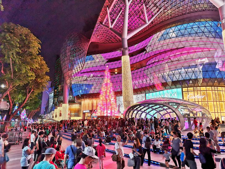 Orchard Road illuminated at night, highlighting Singapore's vibrant shopping district