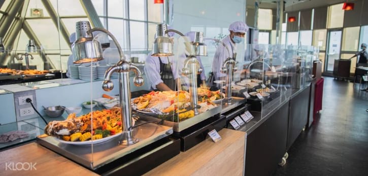 Panoramic view of Baiyoke Sky Hotel's buffet, offering a vast array of international cuisines