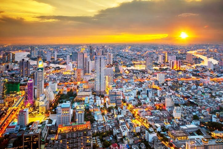 Breathtaking evening view from Mahanakhon SkyWalk, overlooking Bangkok's illuminated cityscape