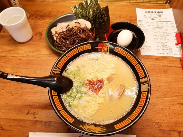 Bowl of Ichiran Ramen with pork and green onions, a must-eat during a Tokyo trip