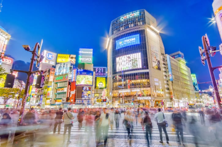 Crowds crossing at Shibuya Crossing, the famous busy intersection in Tokyo