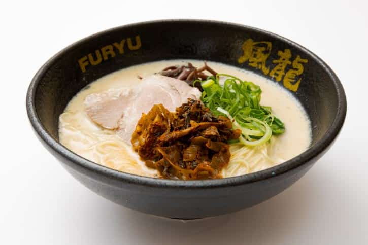 Bowl of Hakata Furyu ramen with pork slices and green onions