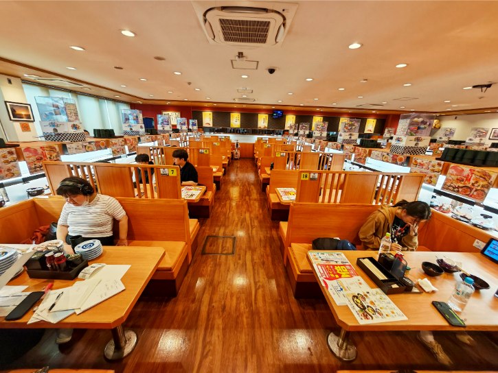 Seats inside the Kura Sushi Shinsekai