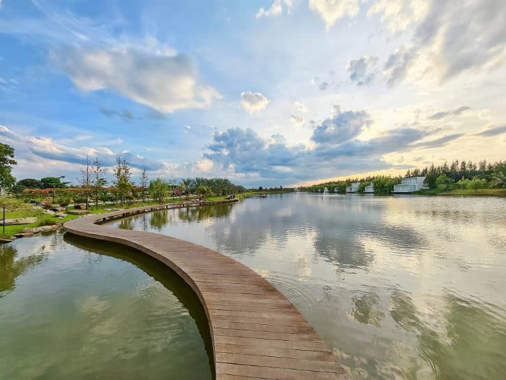 Curved wooden bridge over the lake