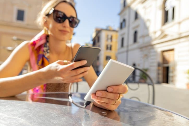 Portable Power Bank Charging a Smartphone