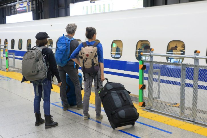 Travelers Boarding Shinkansen Train